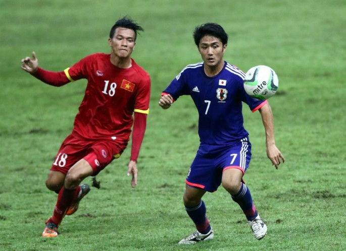 Vietnam's HN Thang (L) in a match versus Japan.