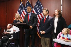U.S. Sen. Cory Booker (D-NJ) (3rd L) speaks during a news conference on medical marijuana as U.S. Sen. Kirsten Gillibrand (D-NY) (2nd L), U.S. Sen. Rand Paul (R-KY) (3rd R), Kate Hintz (2nd R) and Morgan Hintz (R), who suffers from a rare form of epilepsy