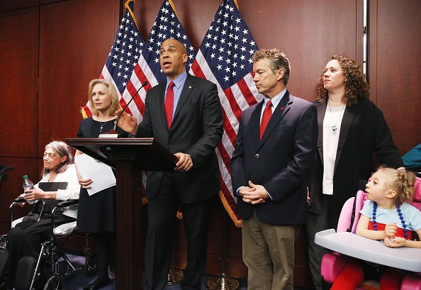 U.S. Sen. Cory Booker (D-NJ) (3rd L) speaks during a news conference on medical marijuana as U.S. Sen. Kirsten Gillibrand (D-NY) (2nd L), U.S. Sen. Rand Paul (R-KY) (3rd R), Kate Hintz (2nd R) and Morgan Hintz (R), who suffers from a rare form of epilepsy