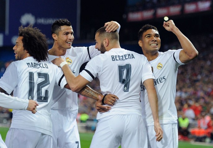 Real Madrid celebrates Karim Benzema's opening goal in the recent Madrid derby.