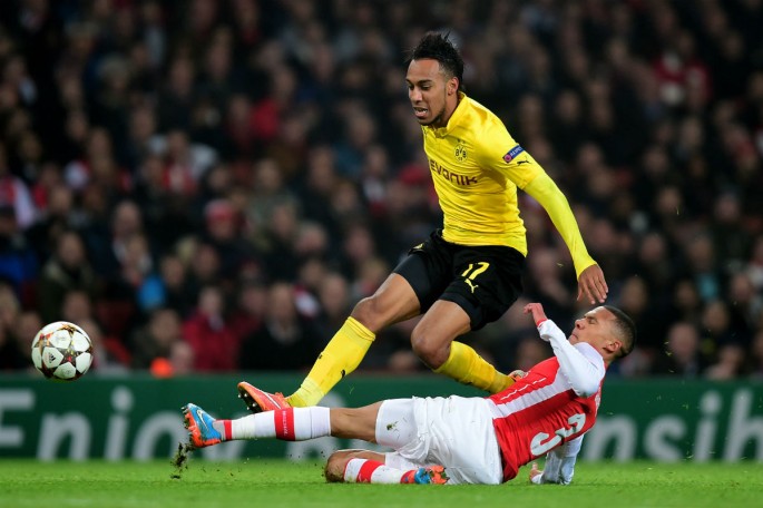 Pierre-Emerick Aubameyang of Borussia Dortmund is tackled by Kieran Gibbs of Arsenal during their UEFA Champions League Group D match.