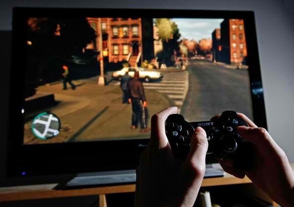 A young man plays Grand Theft Auto IV on the game's day of release on April 29, 2008 in London, England. 