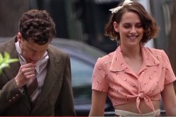Kristen Stewart wears a peach knotted blouse with her soft curls, to get into character for the new Woody Allen film; Jesse Eisenberg co-stars.