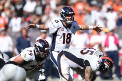 Denver Broncos quarterback Peyton Manning (#18).