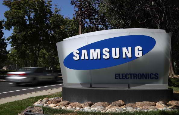 A Samsung logo is situated outside the company headquarters.