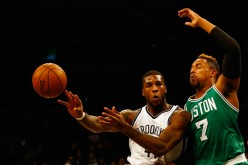 Celtics' Jared Sullinger (#7) defends against Brooklyn Nets' Thomas Robinson during their preseason game.
