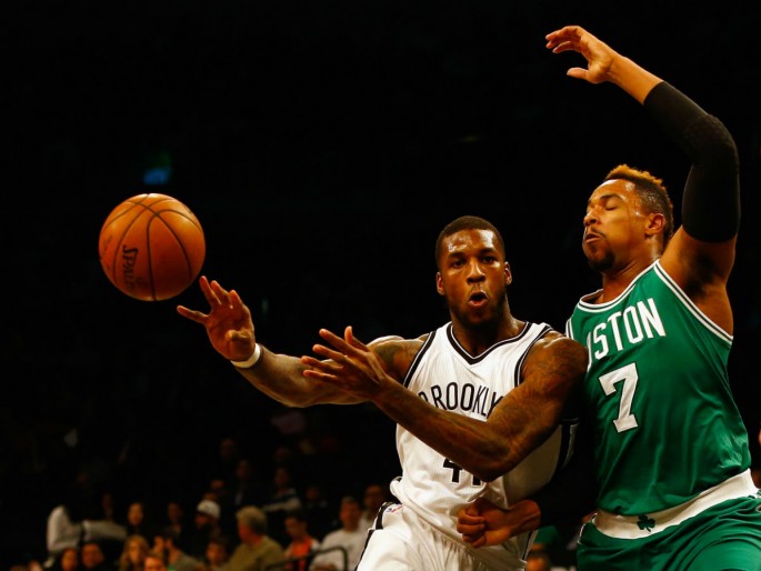 Celtics' Jared Sullinger (#7) defends against Brooklyn Nets' Thomas Robinson during their preseason game.