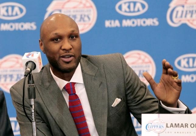 Basketball player, Lamar Odom, speaks at a news conference  