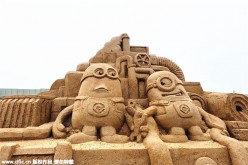 A sand sculpture featuring minions is on display at a beach park in Changde City, Hunan Province, Oct 10, 2015. 