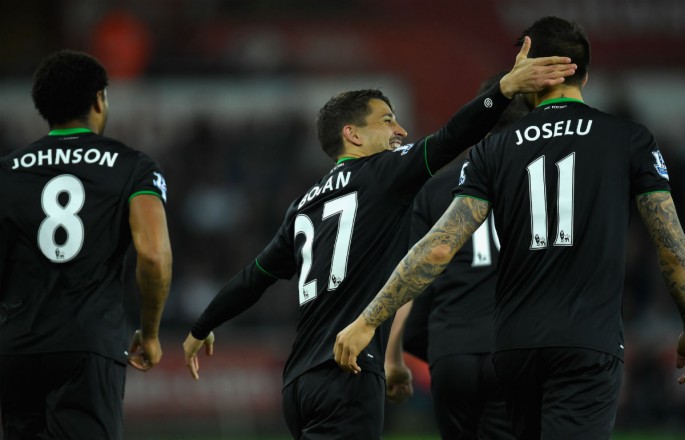 Stoke City winger Bojan Krkic (#27) celebrates with Joselu after scoring their first goal from the penalty spot against Swansea City.