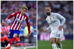 Atletico Madrid's Antoine Griezmann (L) and Real Madrid's Isco.