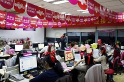 Employees of Tmall, an online retail website, attend to online customers during the grand sale held on Nov. 11, 2014.