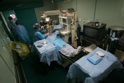 Doctors carry out a cataract removal surgery for a patient on Express May 11, 2008, in Nanyang, Henan Province.