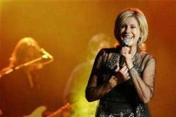 Olivia Newton-John is seen performing at a concert in Singapore.