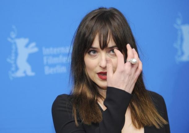 Actress Dakota Johnson arrives for the screening of the movie 'Fifty Shades of Grey' at the 65th Berlinale International Film Festival in Berlin 