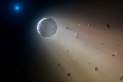 In this artist’s conception, a tiny rocky object vaporizes as it orbits a white dwarf star. Astronomers have detected the first planetary object transiting a white dwarf using data from the K2 mission. Slowly the object will disintegrate, leaving a dustin