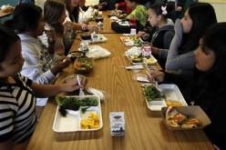 Students sit down to eat a healthy lunch at Marston Middle School in San Diego.