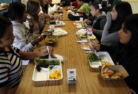 Students sit down to eat a healthy lunch at Marston Middle School in San Diego.