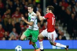 Wolfsburg winger Julian Draxler runs past Manchester United's Daley Blind during their recent Champions League Match.
