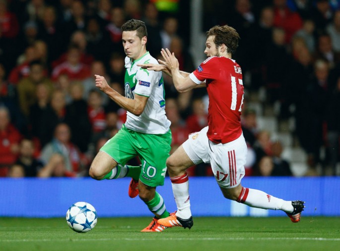Wolfsburg winger Julian Draxler runs past Manchester United's Daley Blind during their recent Champions League Match.