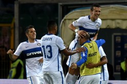 Inter Milan winger Ivan Perisic celebrates with teammates after scoring the opening goal of their Serie A match versus Palermo.