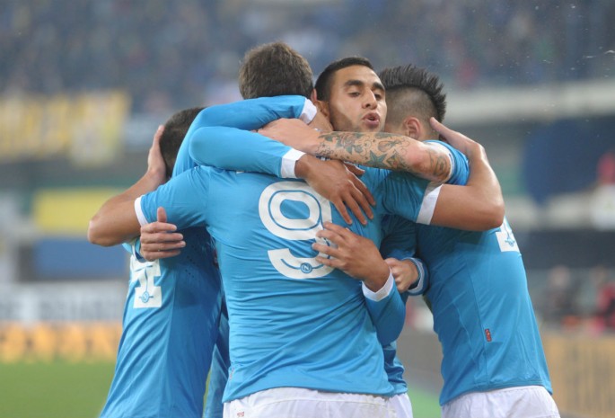Napoli striker Gonzalo Higuaín (#9) is mobbed by teammates after scoring the winning goal against Chievo.