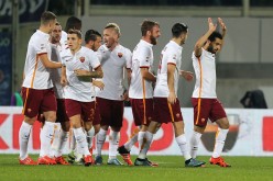Roma forward Mohamed Salah (R) celebrates with teammates after scoring a goal against Fiorentina in their recent Serie A matchup.
