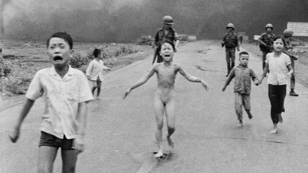 Nine-year-old Kim Phuc is seen here running with her brothers and cousins after being hit by napalm during Vietnam War.