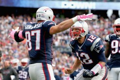 New England Patriots tight end Rob Gronkowski (#87) celebrates after he received a pass from quarterback Tom Brady (#12) for a touchdown.
