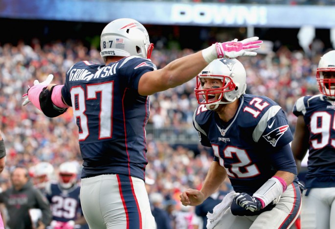 New England Patriots tight end Rob Gronkowski (#87) celebrates after he received a pass from quarterback Tom Brady (#12) for a touchdown.