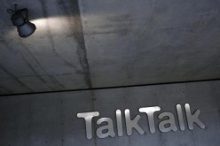 A spotlight shines on a company logo at a TalkTalk building in London, Britain.