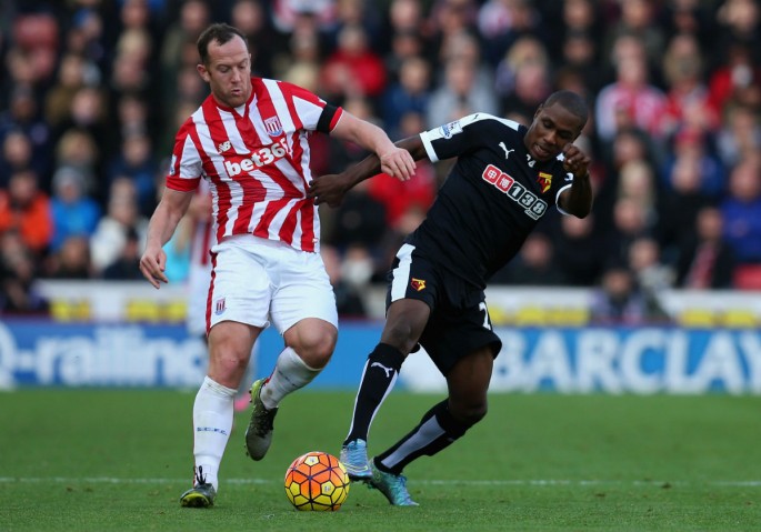Stoke City midfielder Charlie Adam competes for the ball against Watford's Odion Ighalo.