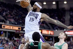 Sacramento Kings forward DeMarcus Cousins dunks the ball over the Boston Celtics in a game last season.