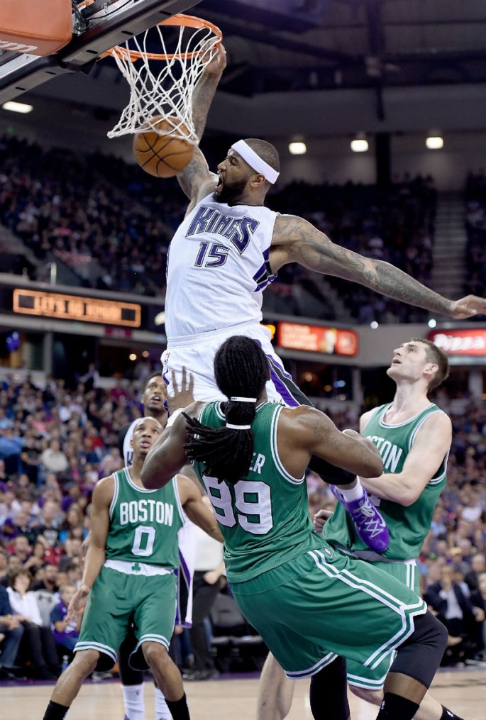 Sacramento Kings forward DeMarcus Cousins dunks the ball over the Boston Celtics in a game last season.