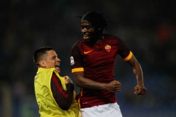 Roma forward Gervinho (R) celebrates with teammate Juan Iturbe after scoring a goal against Udinese.