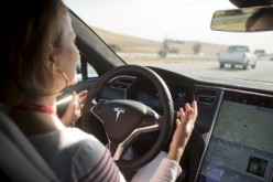 A driver tests Tesla's auto-pilot software, the Version 7.0.