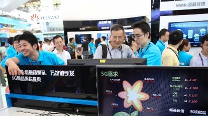 Spectators take a look at the 5G technology during the Mobile World Congress in Shanghai in July.
