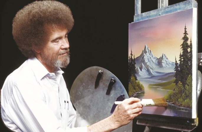 Bob Ross in one of his episodes on "The Joy of Painting" as he paints stream with a beautiful mountain background.