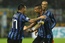 Inter Milan midfielder Gary Medel (#17) celebrates his goal against Roma with his teammates.
