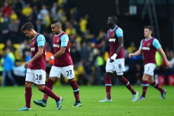 West Ham United players look dejected after their bitter loss to Watford.