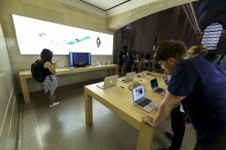 People watch Apple's announcement of new versions of old products at a Apple Store in New York, NY on September 9, 2015. 