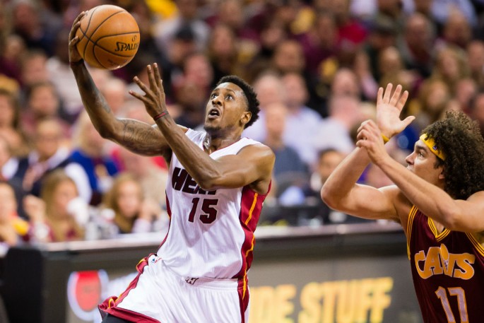 Miami Heat point guard Mario Chalmers (#15) takes a shot against Cleveland Cavaliers' Anderson Varejao.
