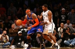 New York Knicks forward Carmelo Anthony makes a move on Brooklyn Nets' Joe Johnson.