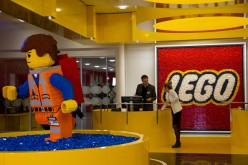 A Lego brick figurine of Emmet Brickowoski, a character from 'The Lego Movie', stands in the reception area at the headquarters of Lego A/S in Billund, Denmark, on Wednesday, Feb. 25, 2015.