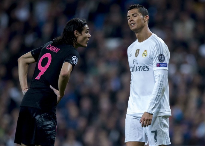 Real Madrid's Cristiano Ronaldo (R) talks with PSG's Edinson Cavani during their recent Champions League match.