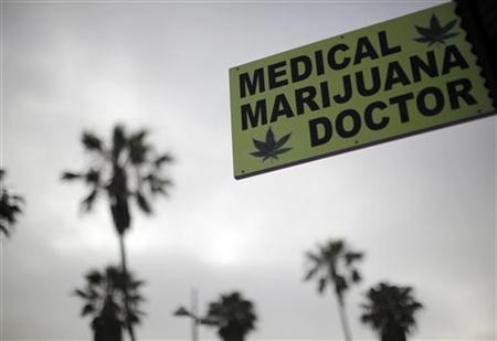 A sign advertises a medical marijuana dispensary on Venice Beach in Los Angeles, California