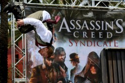 A performer does a flip during an obstacle course at the “Assassin's Creed Syndicate”