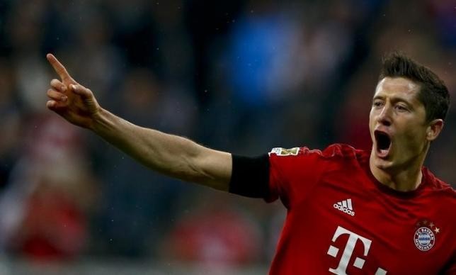 Bayern Munich's Robert Lewandowski reacts after scoring a goal during their German first division Bundesliga soccer match against Wolfsburg in Munich