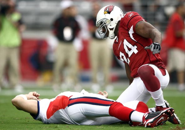 Starting Quarterback Trent Edwards #5 of the Buffalo Bills suffers a concussion after getting hit by Strong Safety Adrian Wilson #24 of the Arizona Cardinals during the first half of their NFL Game on