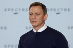 Actor Daniel Craig poses on stage during an event to mark the start of production for the new James Bond film 'Spectre.' 